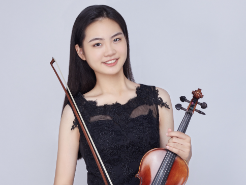 Senior Iris Shi poses with her violin. Photo courtesy of Iris Shi | Used with permission